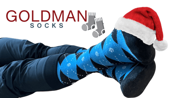 Promotional image for Goldman socks featuring two feet with a Santa on on the toes.