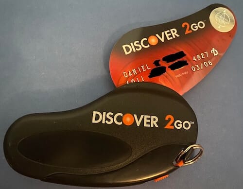 Image of a Discover 2 Go keychain credit card. It is shaped like a cay key fob.