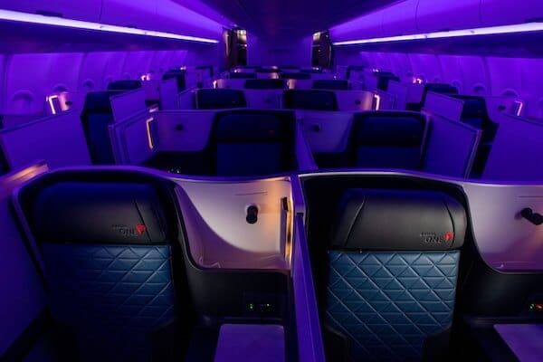 Delta One inflight interior, showing luxurious empty seats.