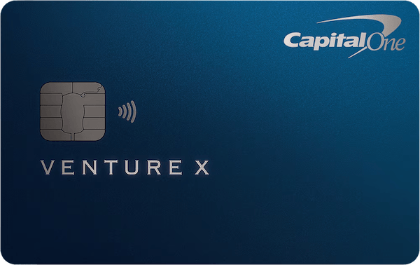 Blue credit card with the Capital One logo in the top right corner, a silver EMV chip, and the brand VENTURE X.
