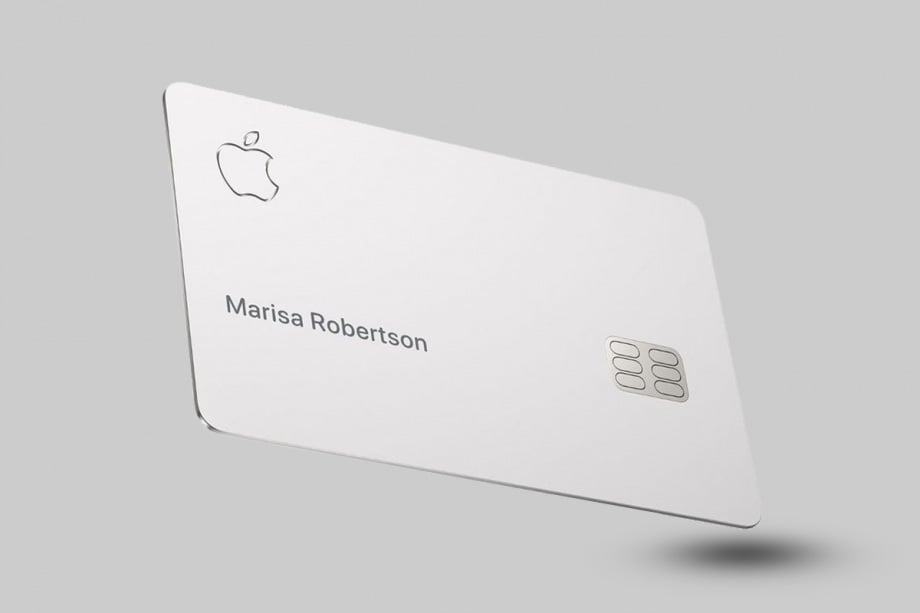 White credit card with the Apple apple logo in the top left corner and the EMV chip in the middle of the right side. Card is floating at an angle on a gray background.